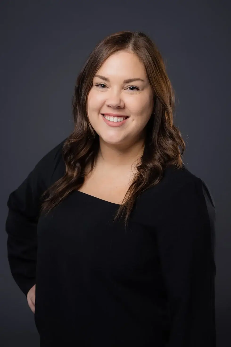 a woman with smiling face and posing for a picture
